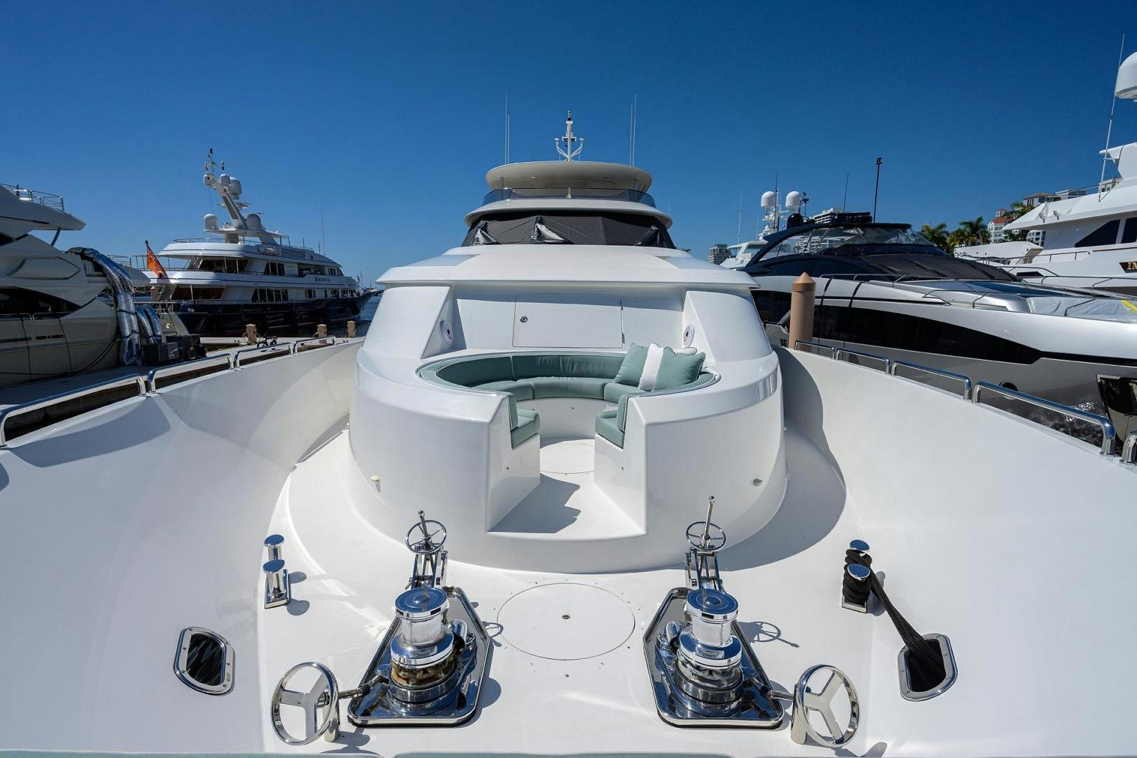 a white boat on a dock aboard CERCA TROVA Yacht for Sale