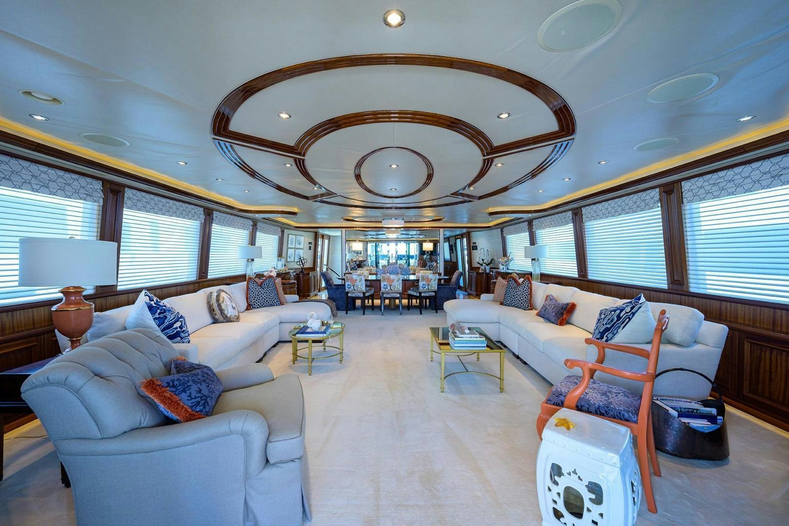 a large living room with a large chandelier aboard CERCA TROVA Yacht for Sale