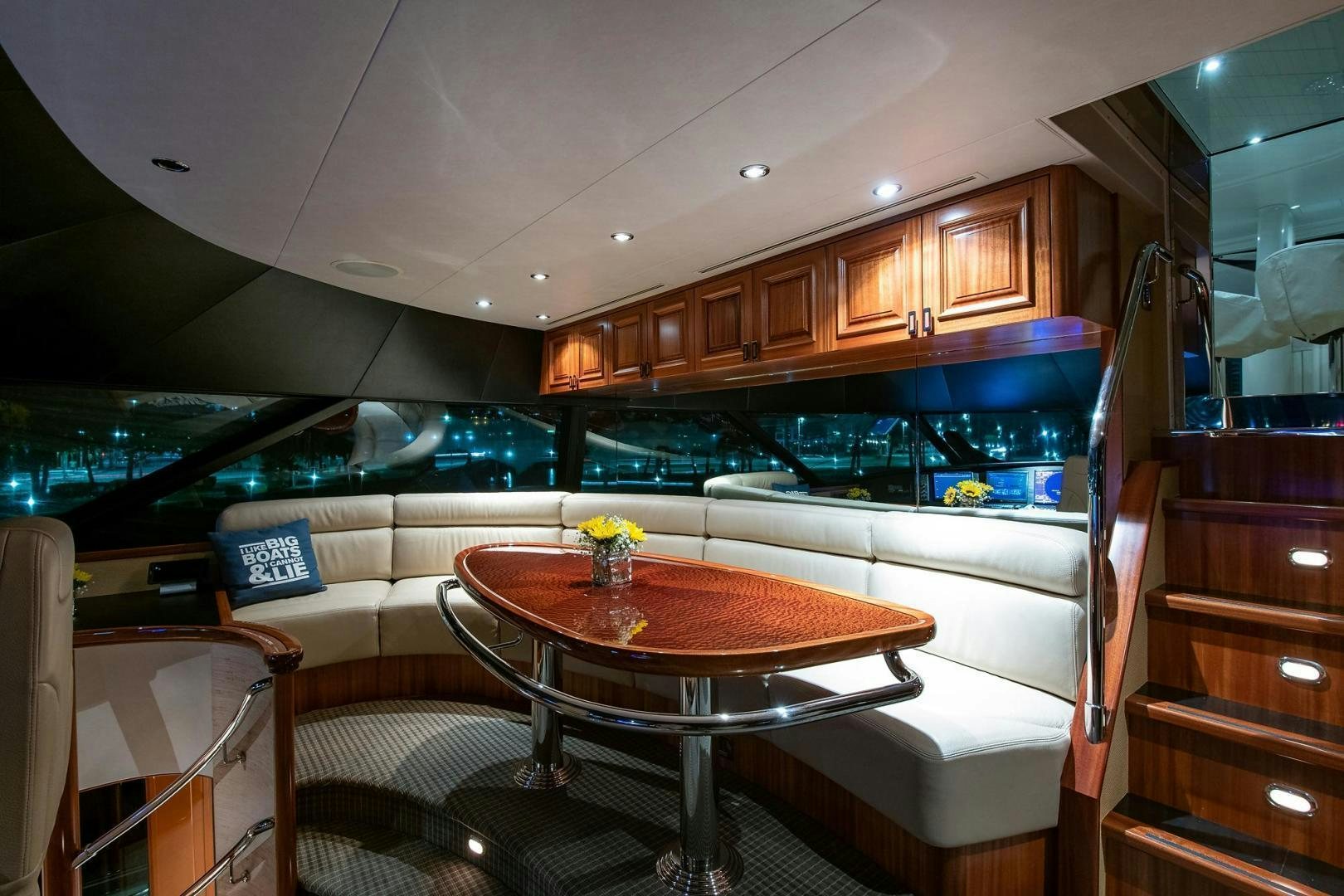 a kitchen with a table and chairs aboard CERCA TROVA Yacht for Sale