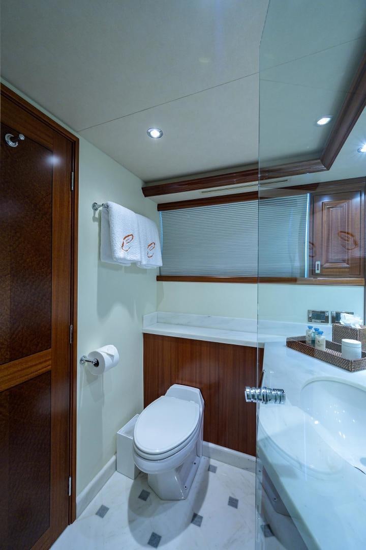 a bathroom with a toilet and bathtub aboard CERCA TROVA Yacht for Sale
