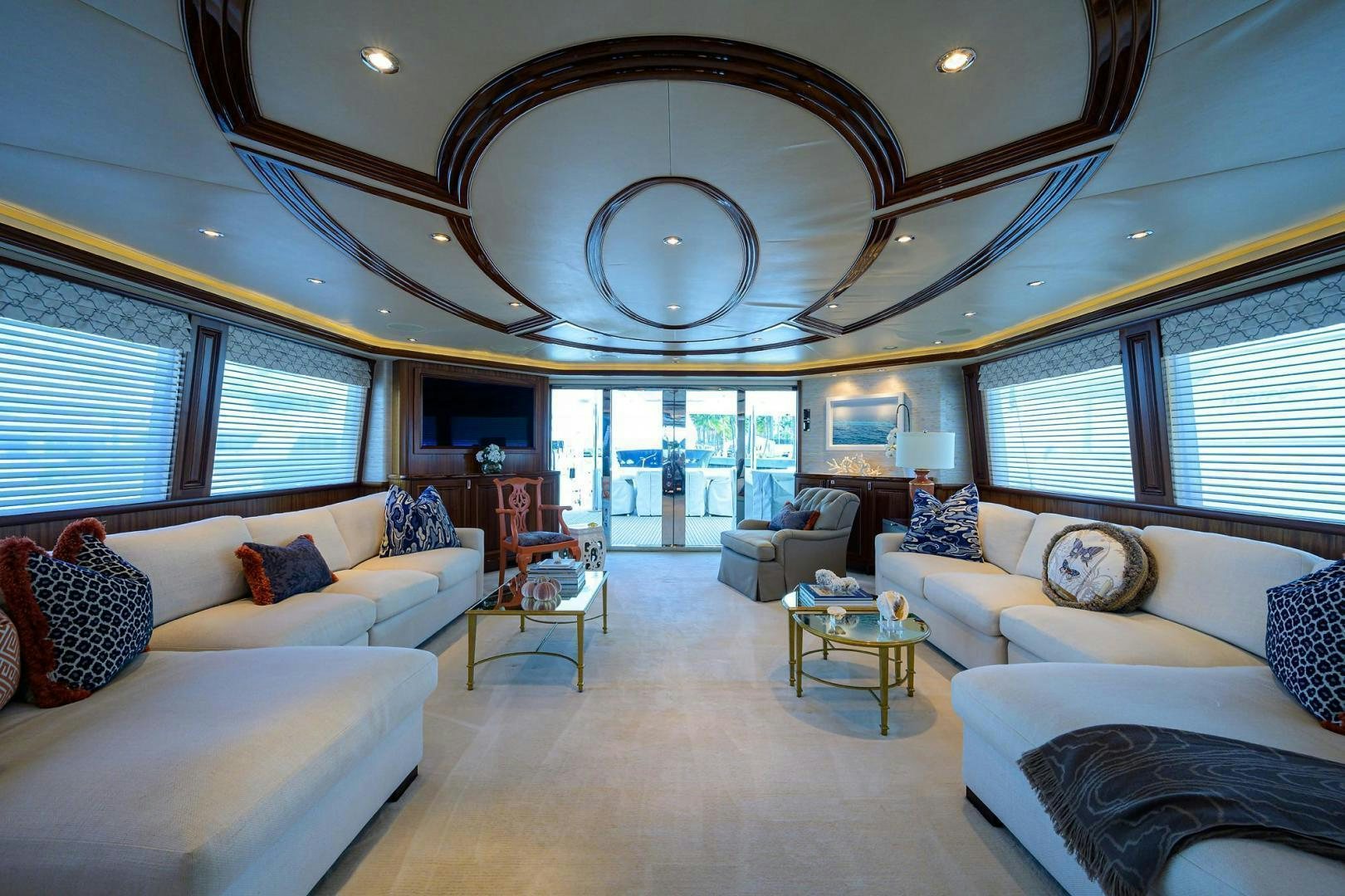 a living room with a large chandelier aboard CERCA TROVA Yacht for Sale