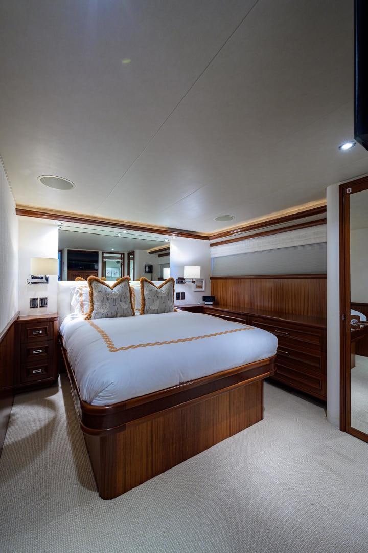 a bedroom with a bed aboard CERCA TROVA Yacht for Sale
