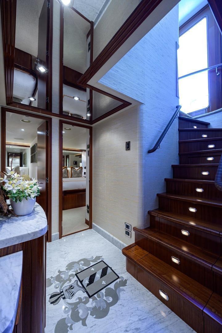a large bathroom with a large wood staircase aboard CERCA TROVA Yacht for Sale