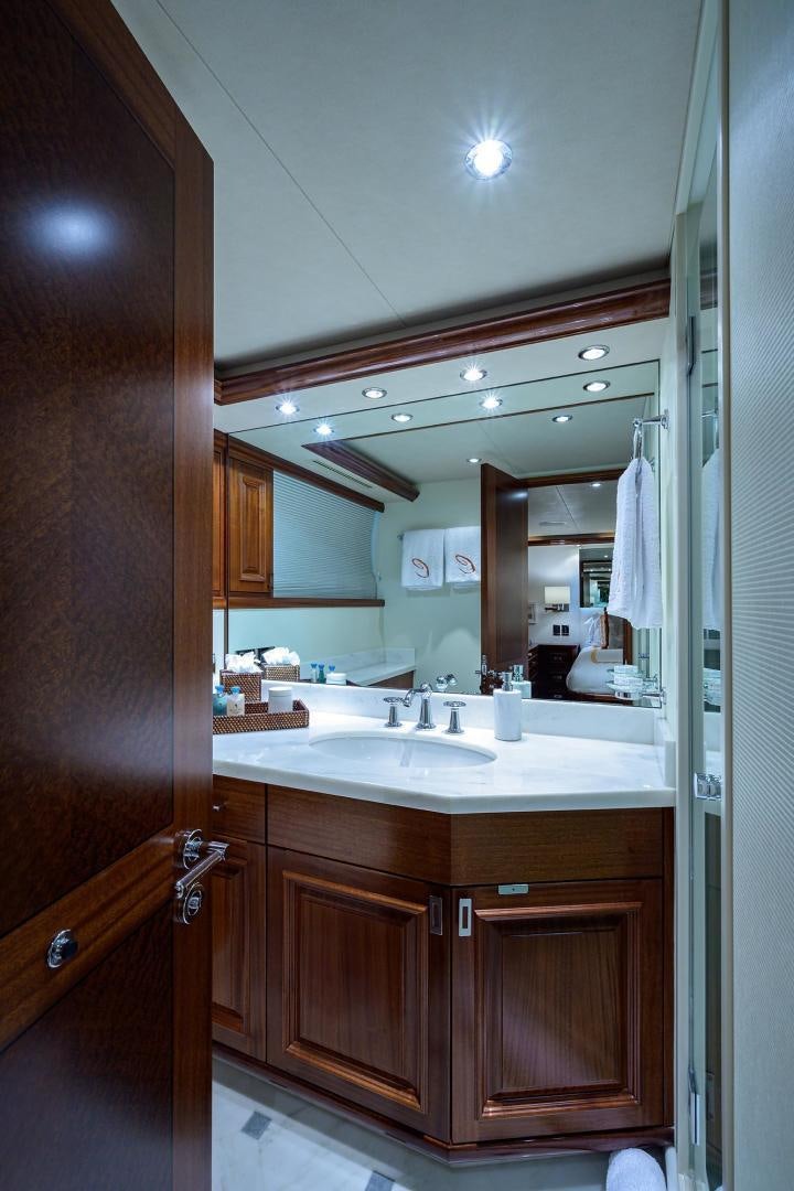 a bathroom with a sink and a mirror aboard CERCA TROVA Yacht for Sale