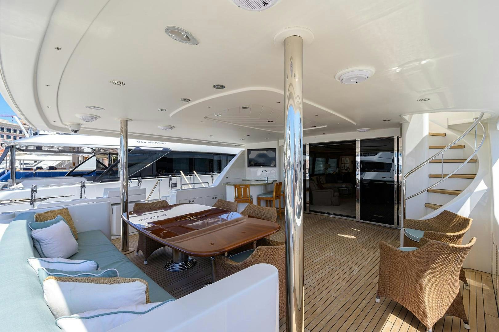 a boat with a table and chairs aboard CERCA TROVA Yacht for Sale