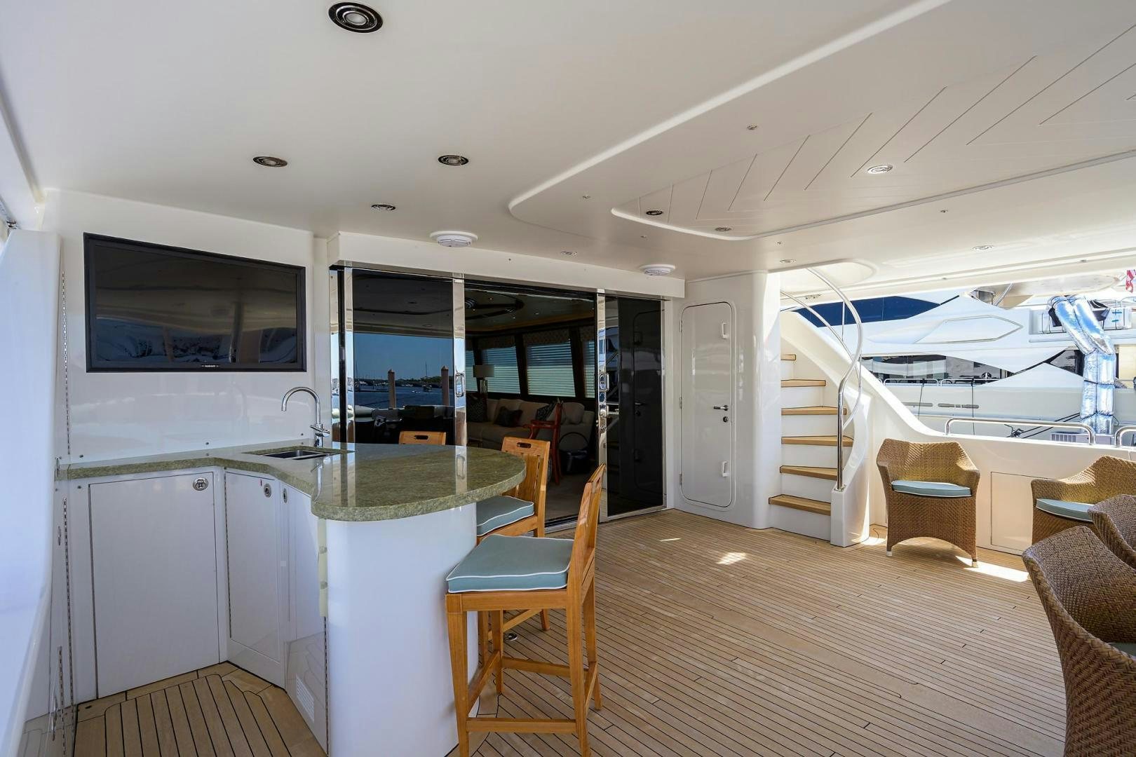 a room with a table and chairs aboard CERCA TROVA Yacht for Sale