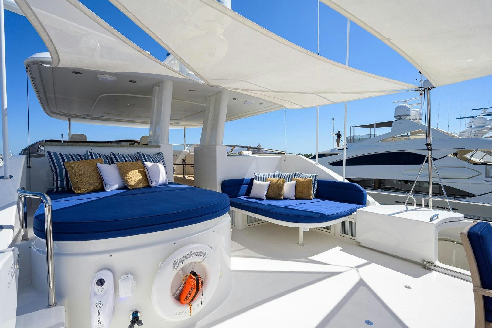 a room with a bed and a blue bed aboard CERCA TROVA Yacht for Sale