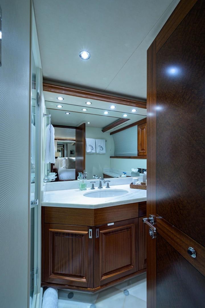 a bathroom with a sink and a mirror aboard CERCA TROVA Yacht for Sale