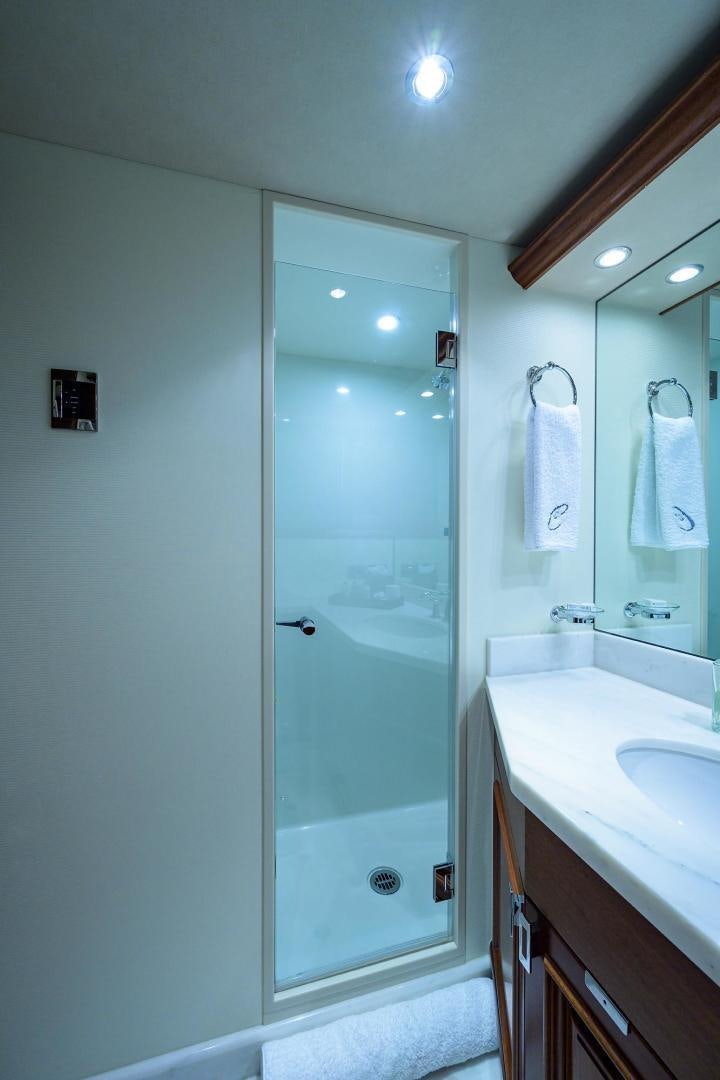 a bathroom with a glass shower aboard CERCA TROVA Yacht for Sale