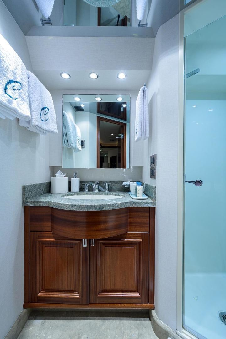a bathroom with a sink and a mirror aboard CERCA TROVA Yacht for Sale