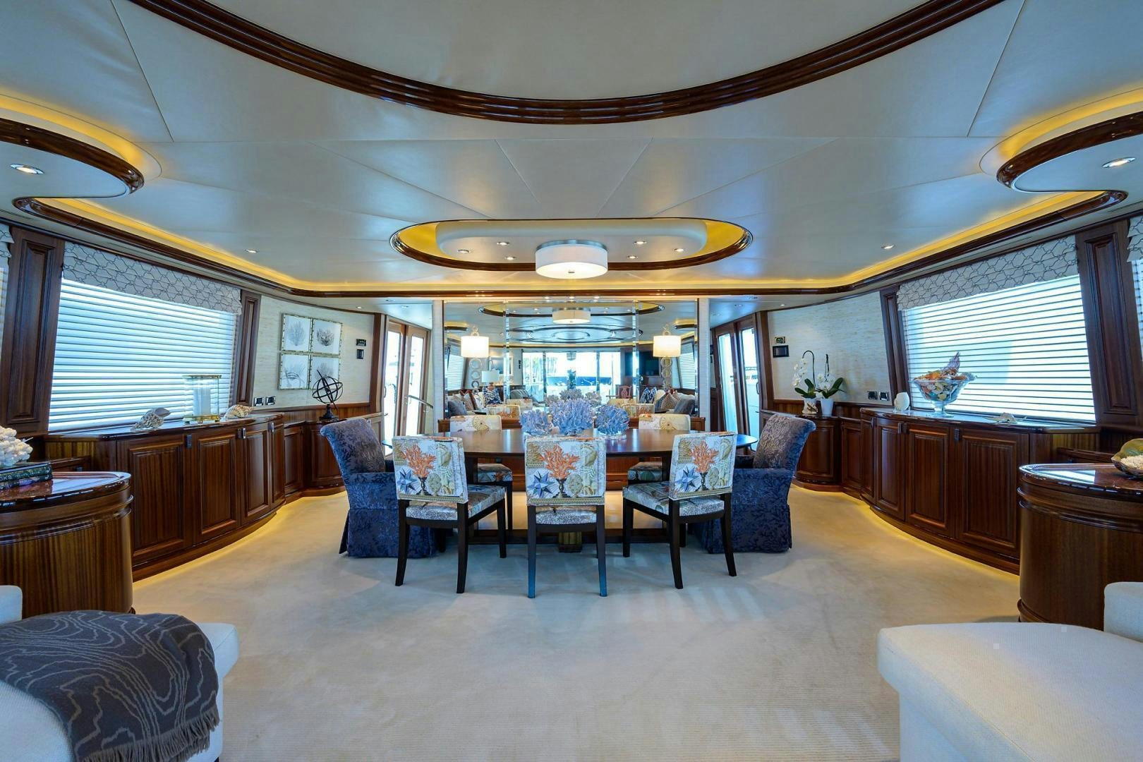 a room with chairs and tables aboard CERCA TROVA Yacht for Sale
