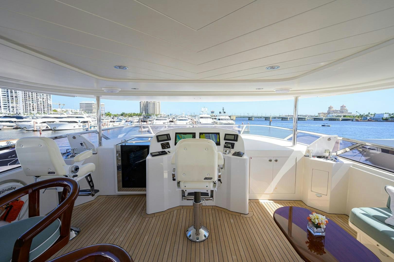 a boat with a table and chairs aboard CERCA TROVA Yacht for Sale