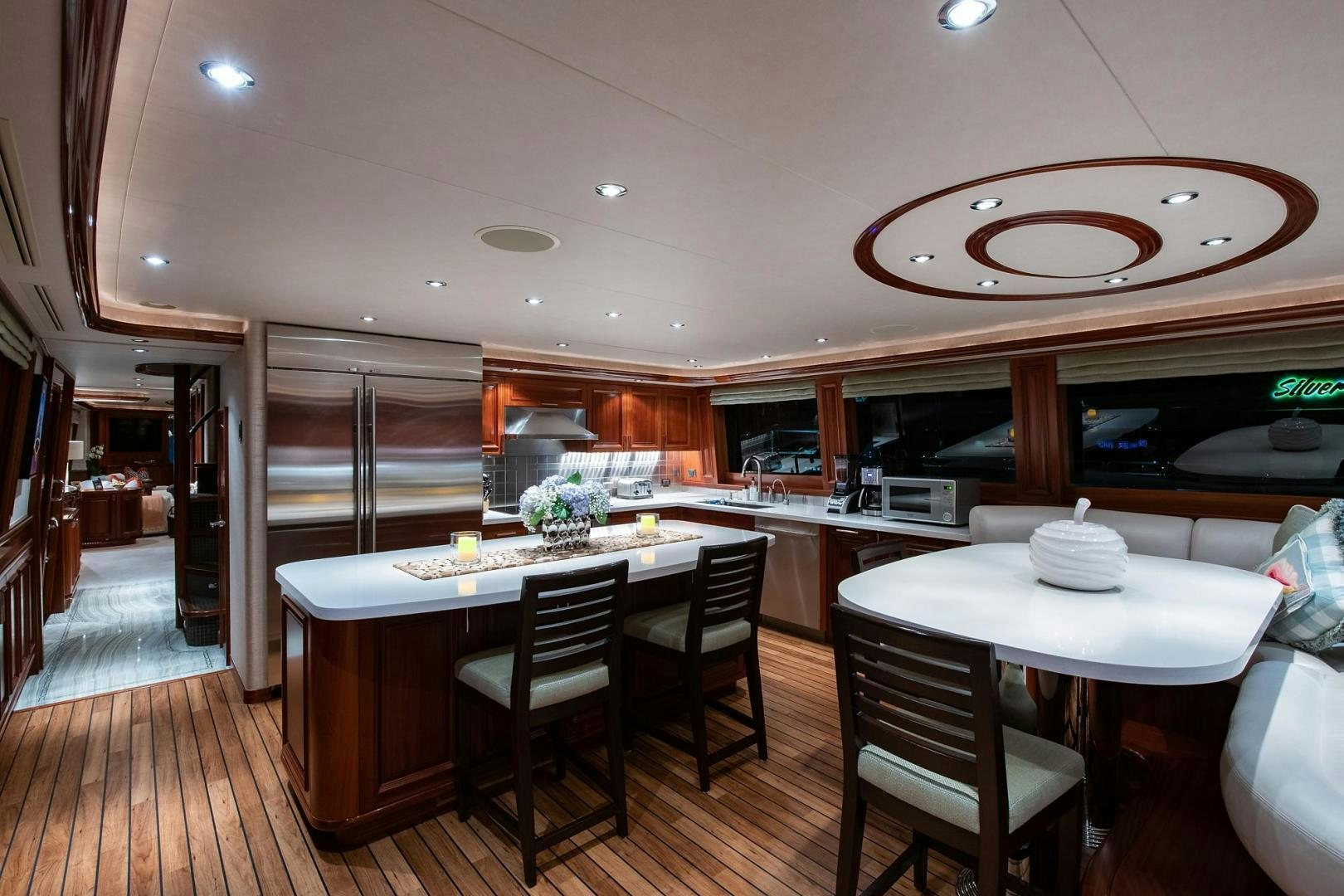 a kitchen with a table and chairs aboard CERCA TROVA Yacht for Sale