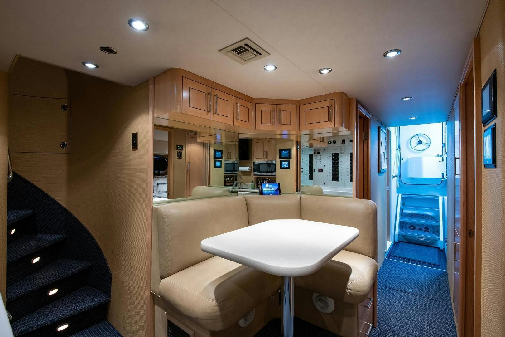 a kitchen with a dining table aboard CERCA TROVA Yacht for Sale