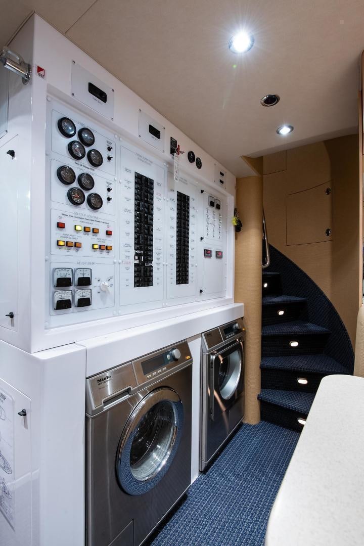 a washing machine in a room aboard CERCA TROVA Yacht for Sale