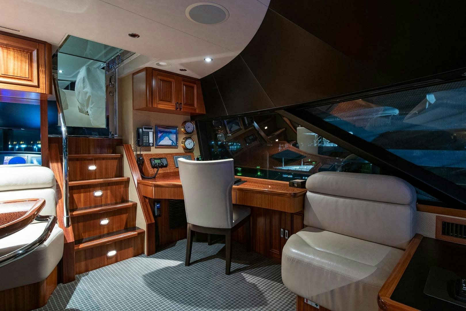 a room with a bed and a chair aboard CERCA TROVA Yacht for Sale