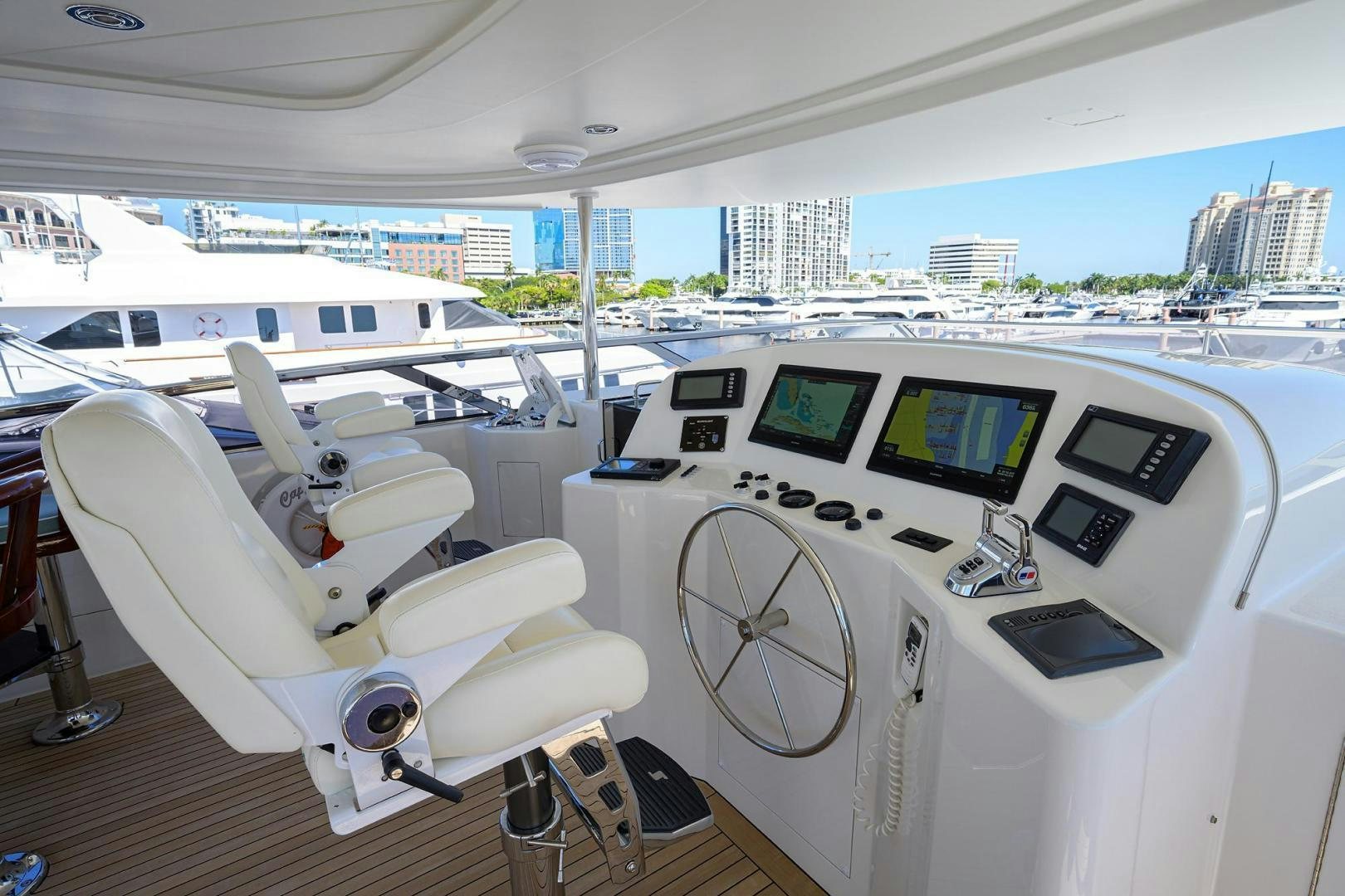 a white yacht with a laptop on it aboard CERCA TROVA Yacht for Sale