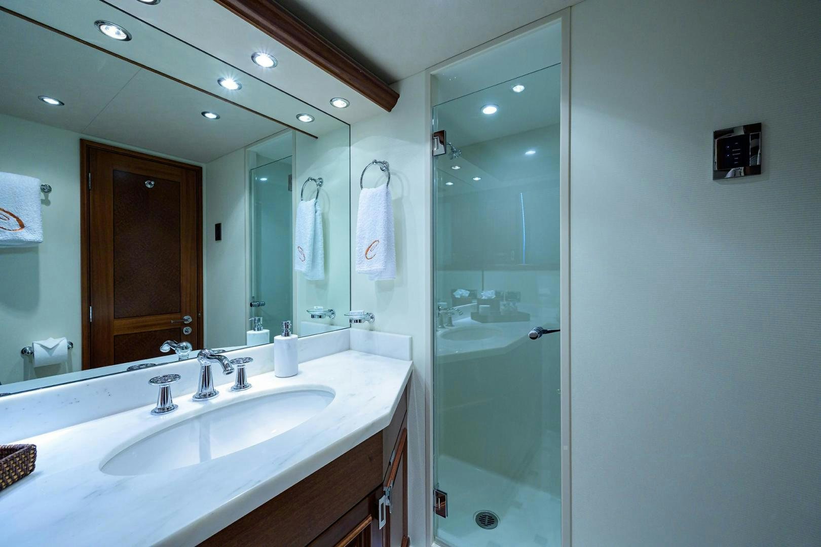 a bathroom with a large mirror aboard CERCA TROVA Yacht for Sale