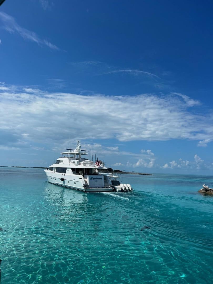 a white boat in the water aboard CERCA TROVA Yacht for Sale