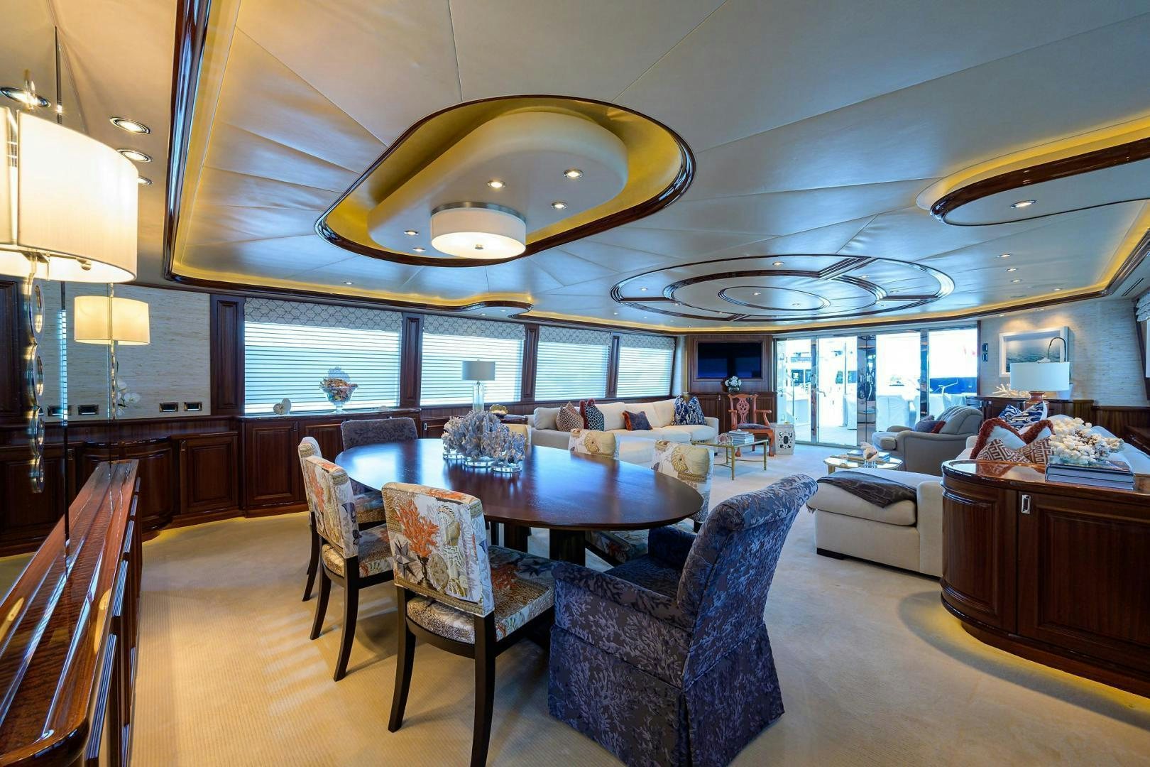 a large room with a table and chairs aboard CERCA TROVA Yacht for Sale
