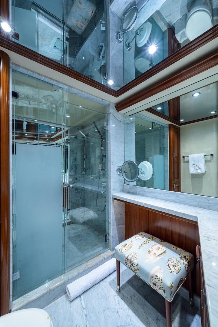 a bathroom with a mirror aboard CERCA TROVA Yacht for Sale