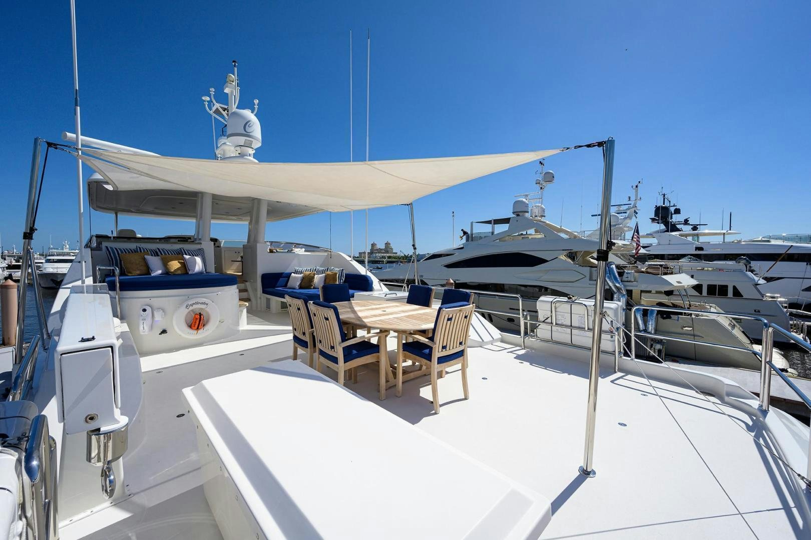 a boat with a table and chairs on it aboard CERCA TROVA Yacht for Sale