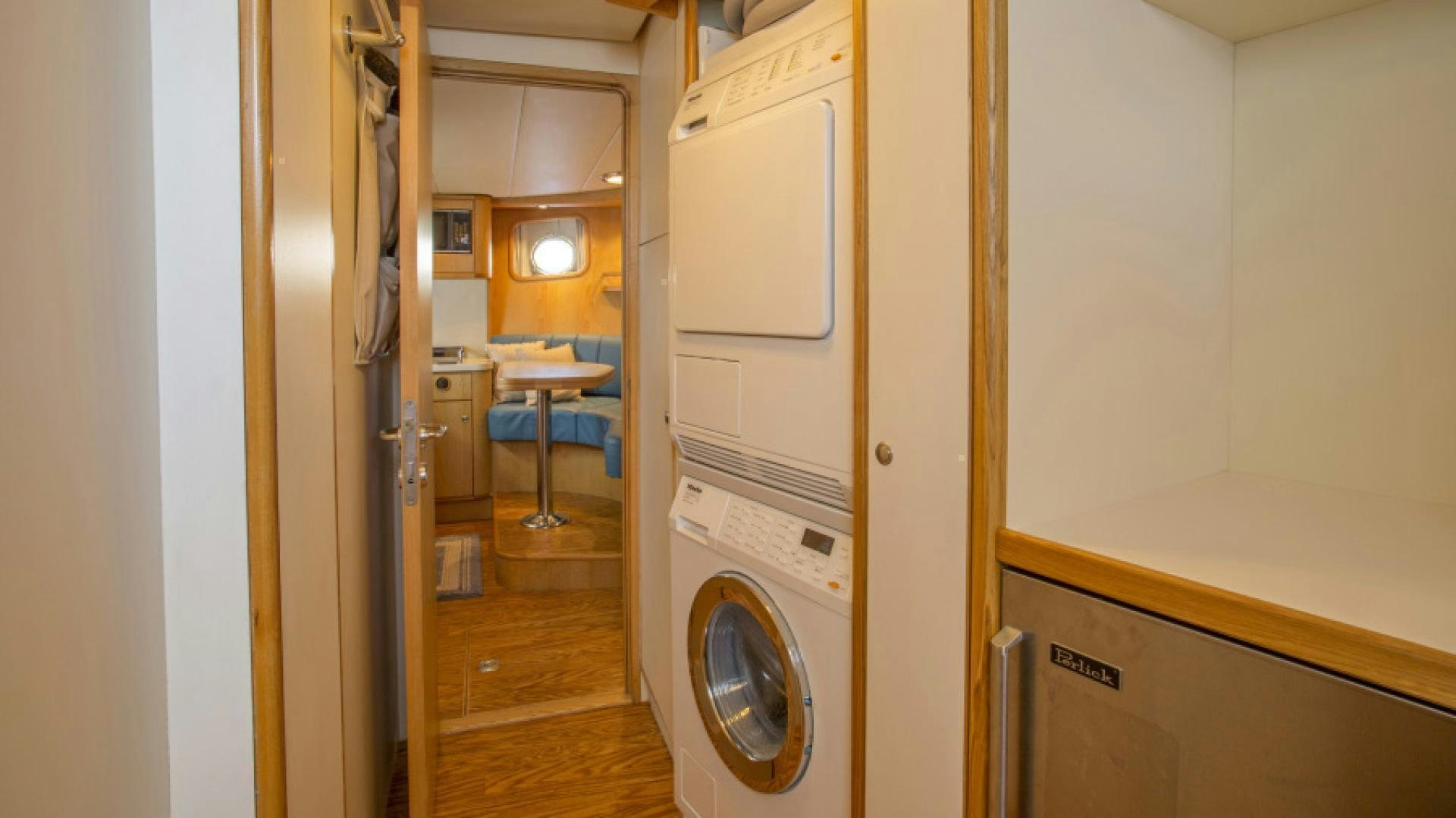 a room with a washing machine and a sink aboard MYU Yacht for Sale