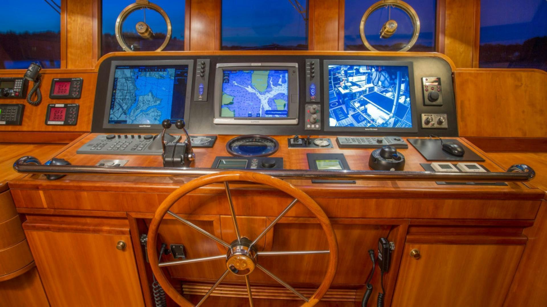 a control panel with a few monitors aboard MYU Yacht for Sale