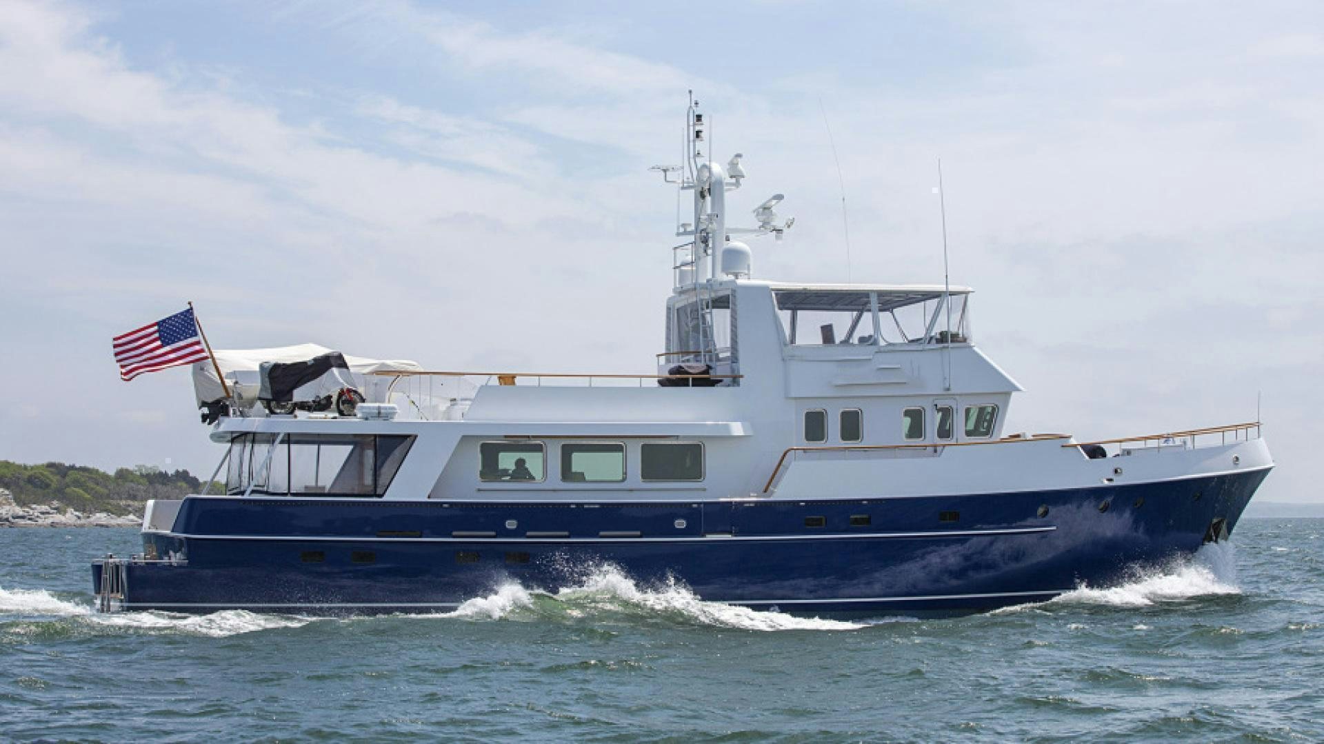 a large boat on the water aboard MYU Yacht for Sale