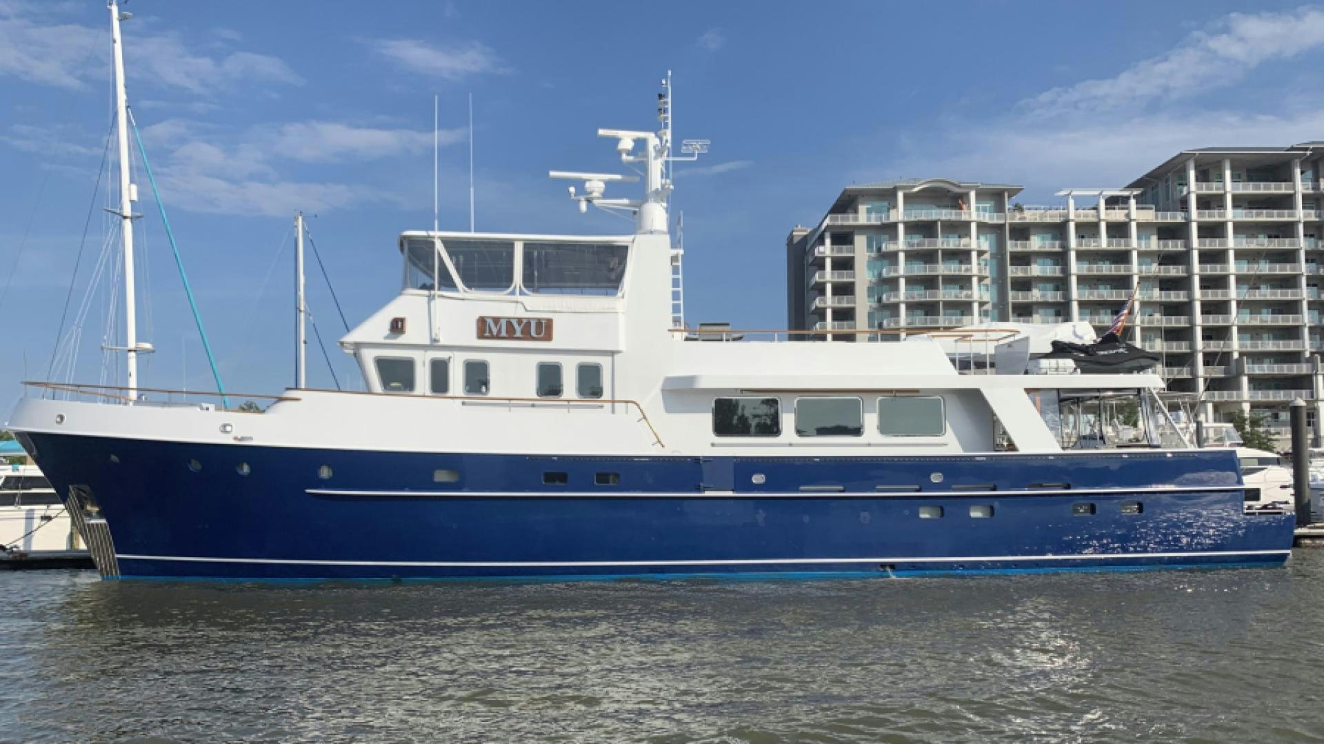 a large white boat in the water aboard MYU Yacht for Sale