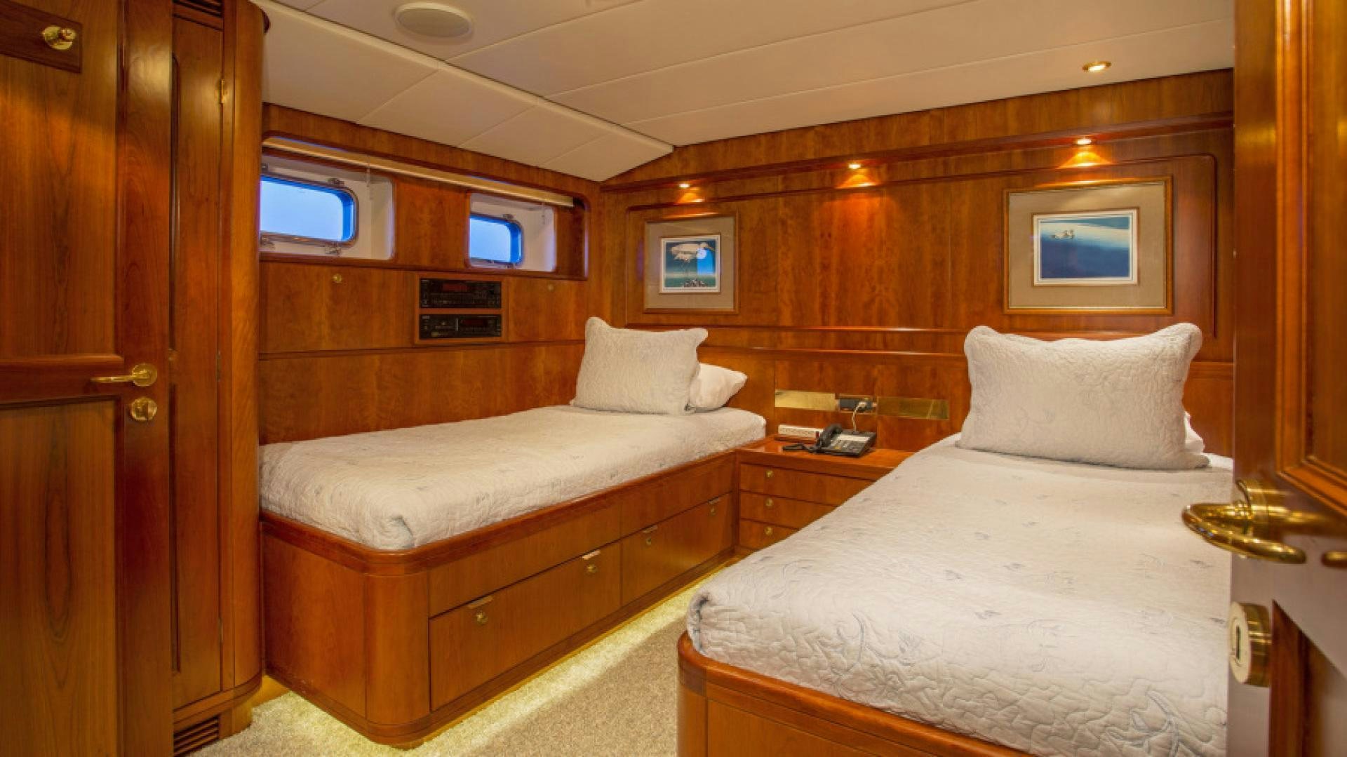 a room with two beds aboard MYU Yacht for Sale