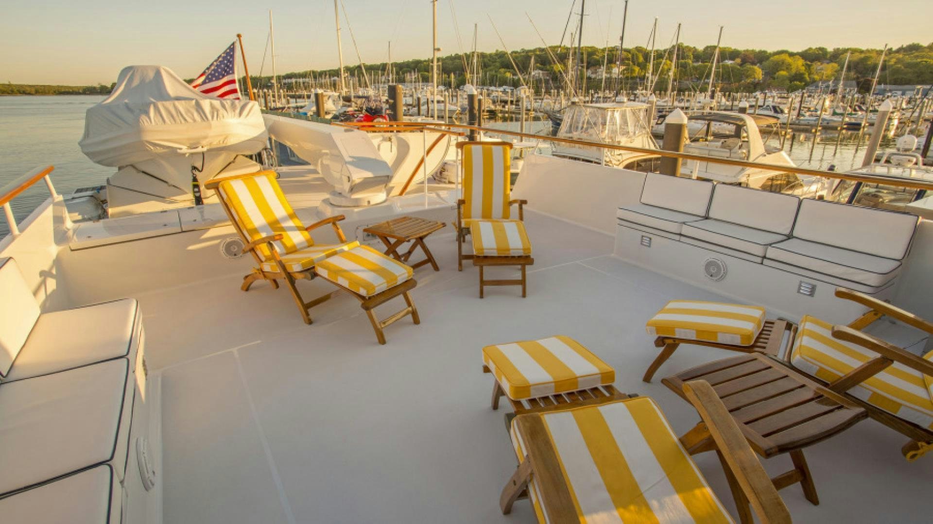 a group of chairs on a dock aboard MYU Yacht for Sale