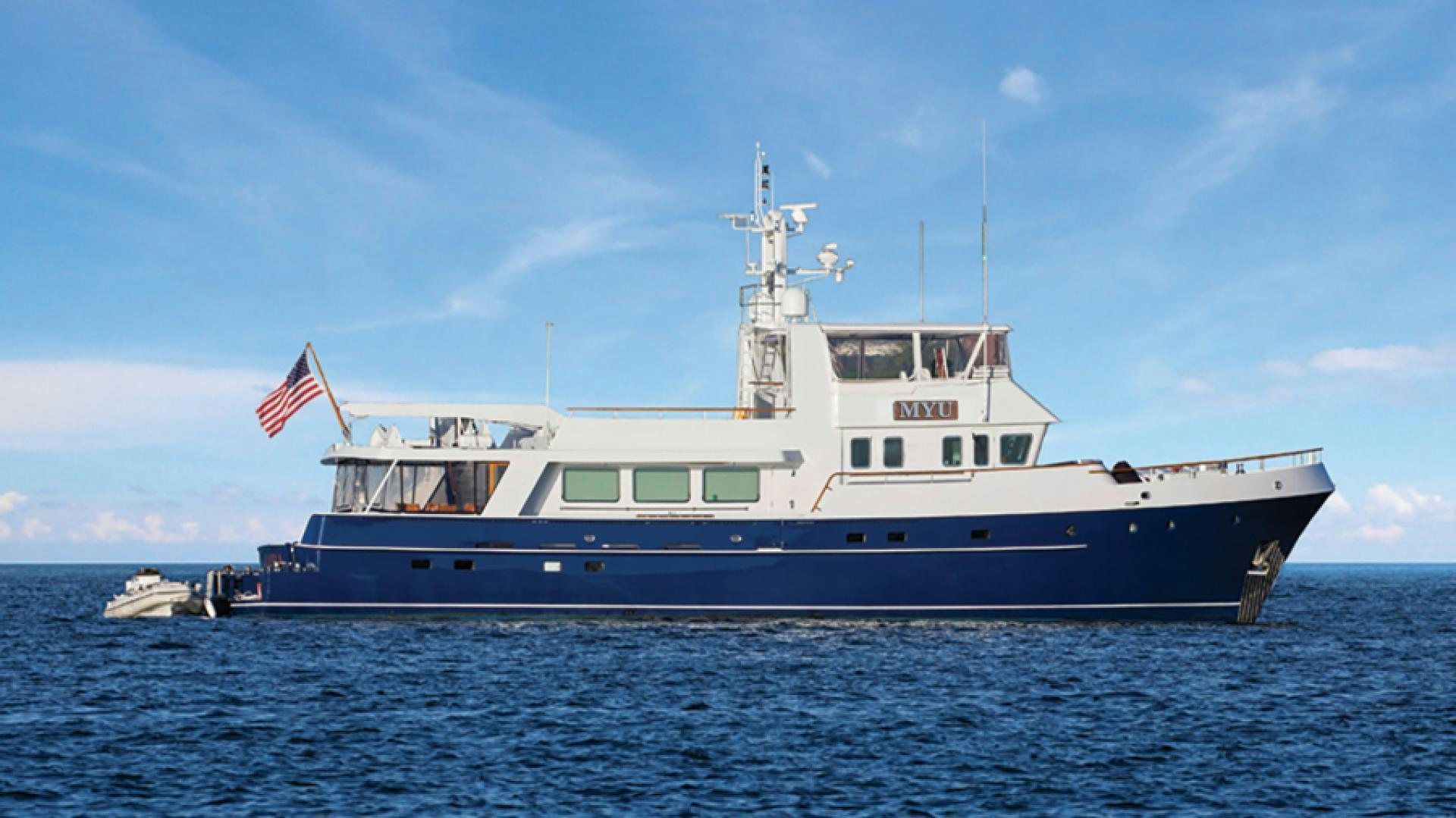 a large boat in the water aboard MYU Yacht for Sale