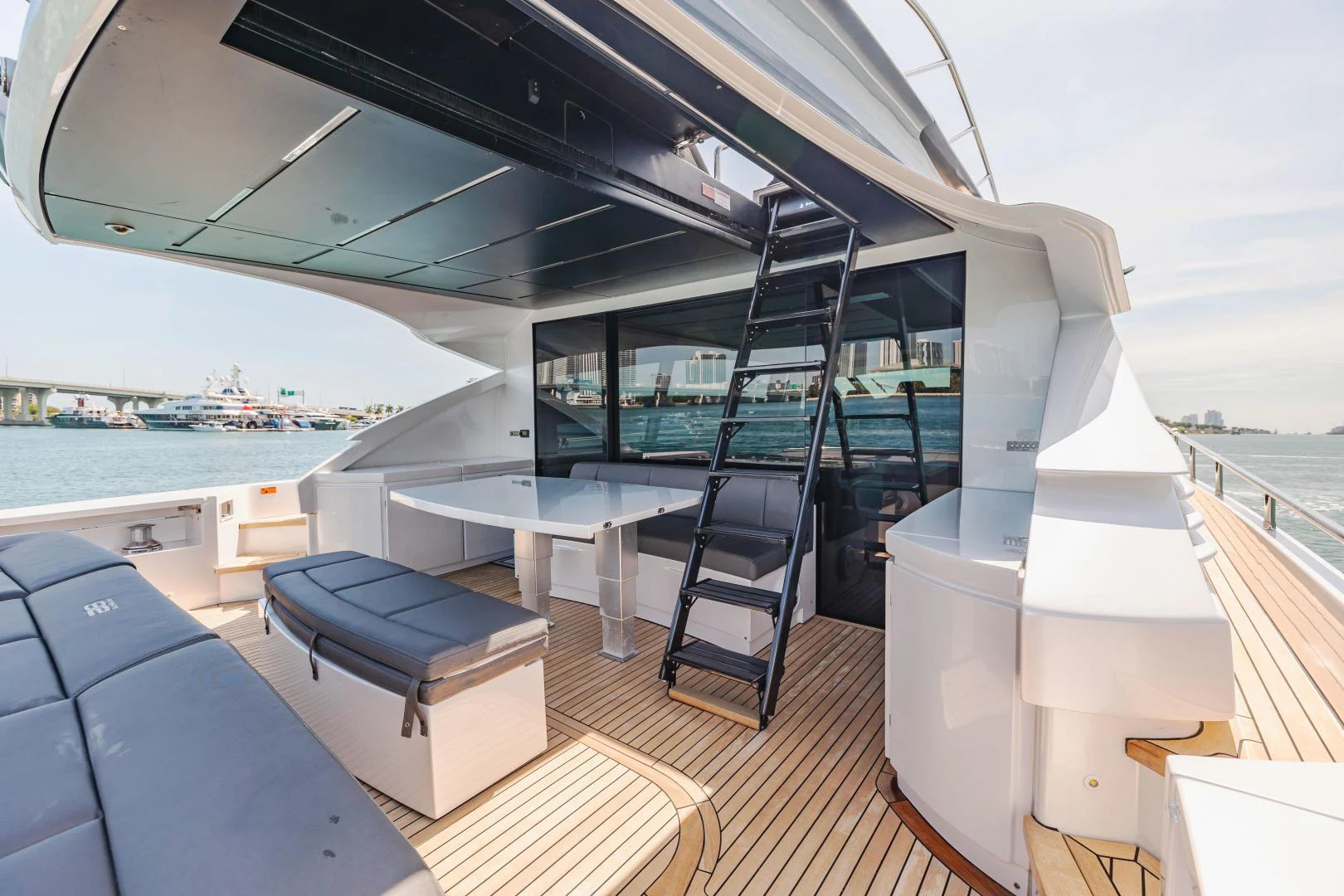 a balcony with a view of the ocean and a beach aboard DOUBLE OR NOTHING Yacht for Sale