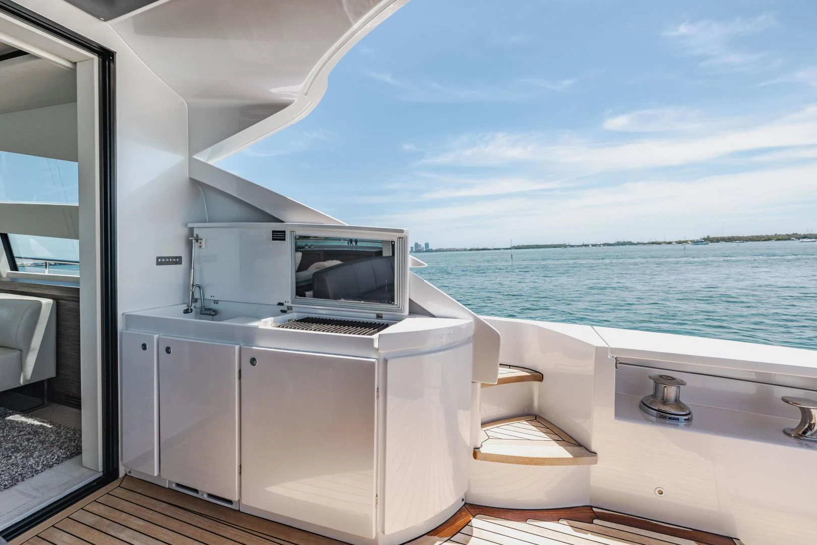 a room with a microwave oven and a table and chairs aboard DOUBLE OR NOTHING Yacht for Sale