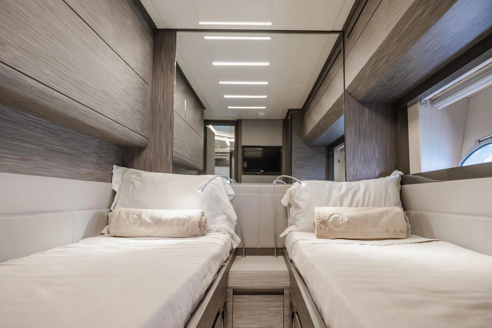 a room with beds and a window aboard DOUBLE OR NOTHING Yacht for Sale