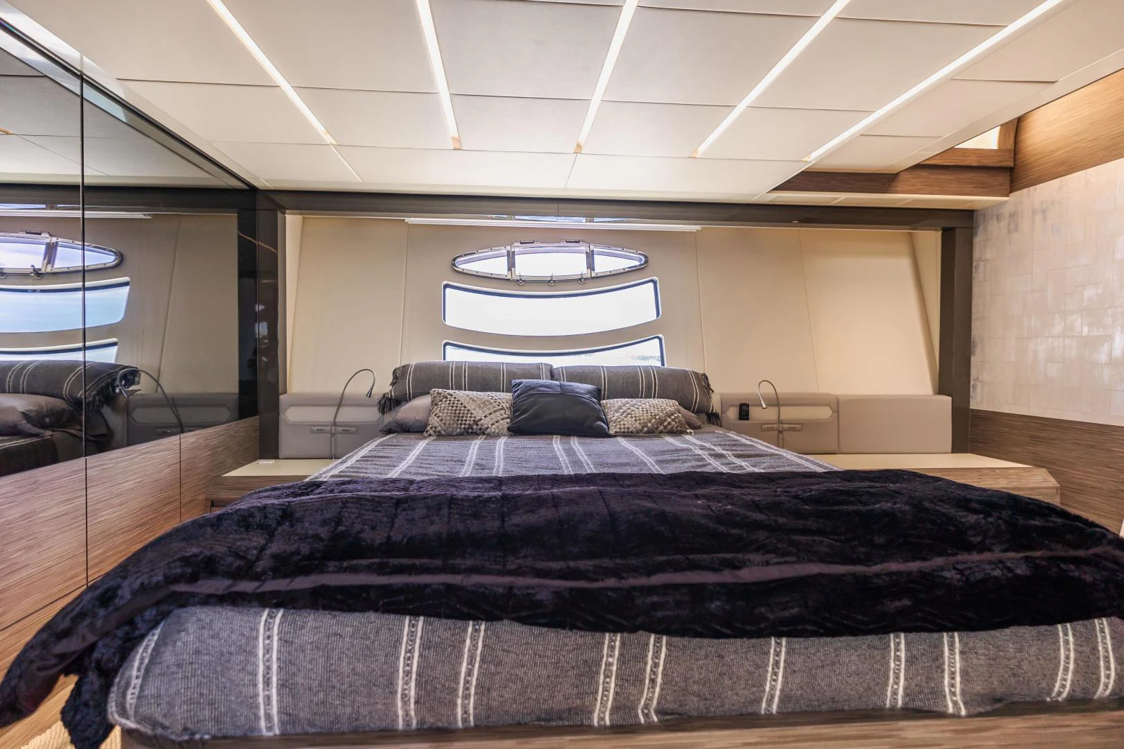 a bed with a black bed spread aboard DOUBLE OR NOTHING Yacht for Sale