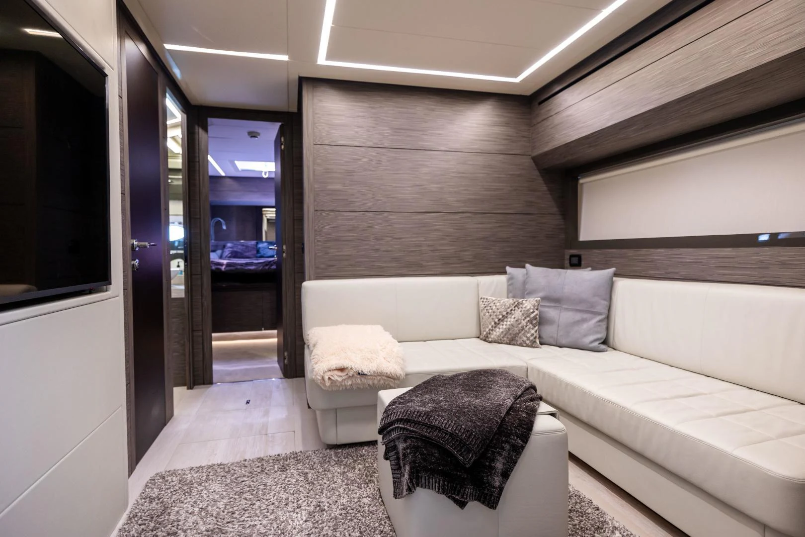a room with a bed and a chair aboard DOUBLE OR NOTHING Yacht for Sale