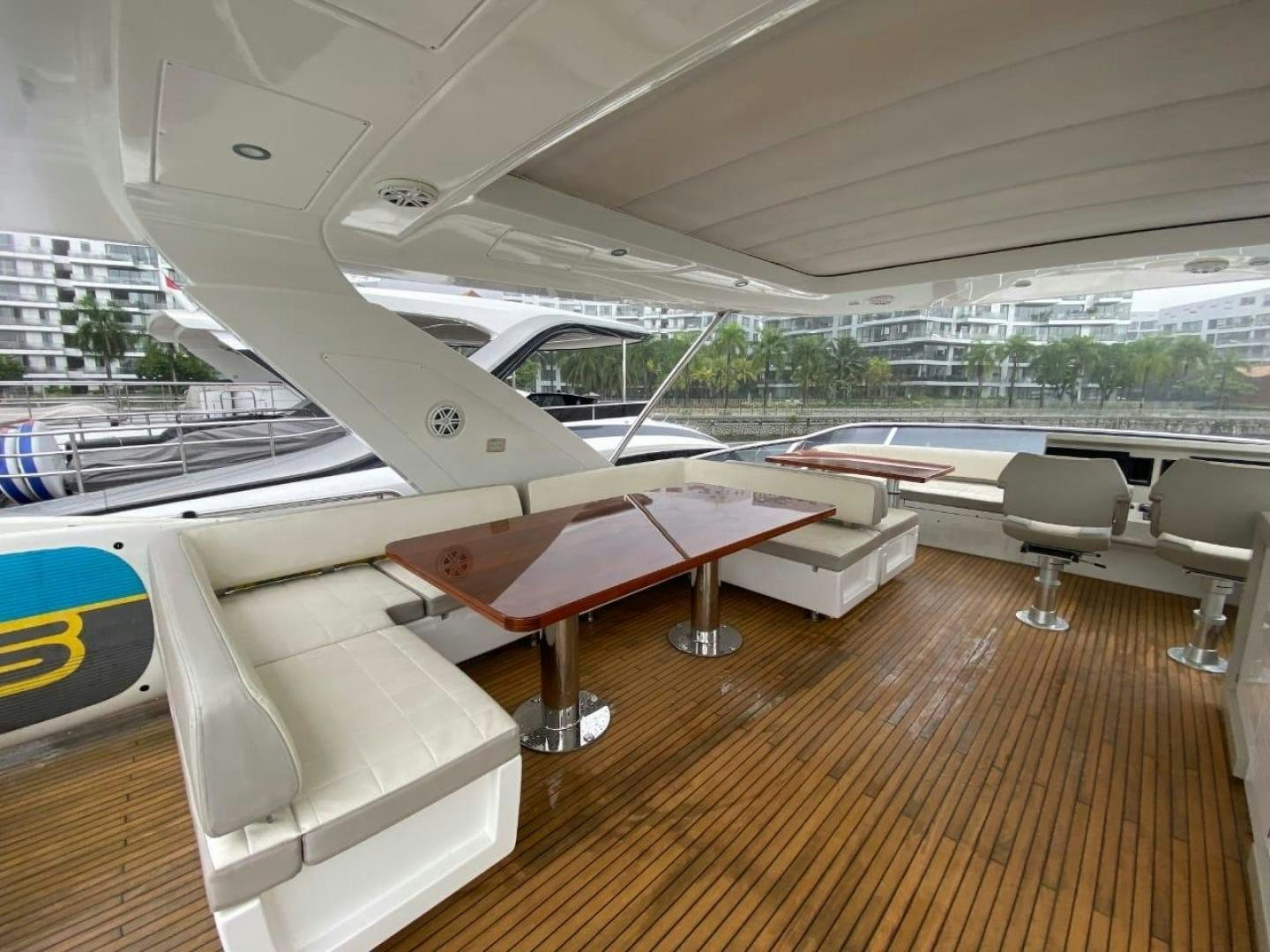 inside of a building with a large window and a view of the city aboard PASEO Yacht for Sale