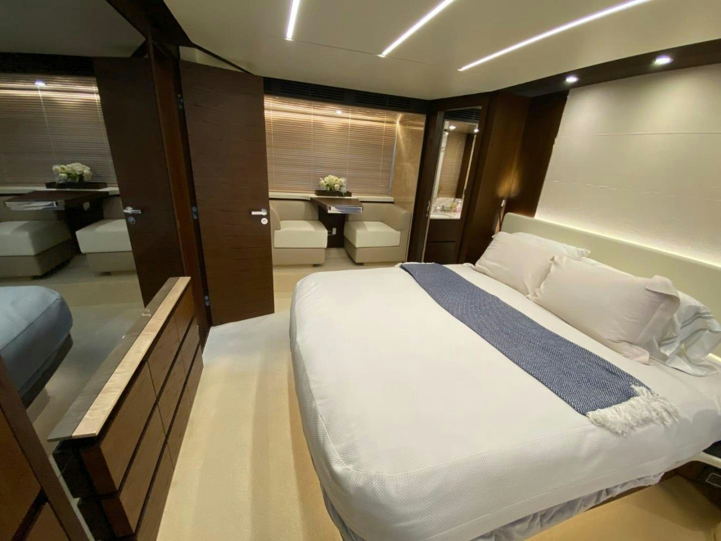 a room with a bed and a table aboard PASEO Yacht for Sale