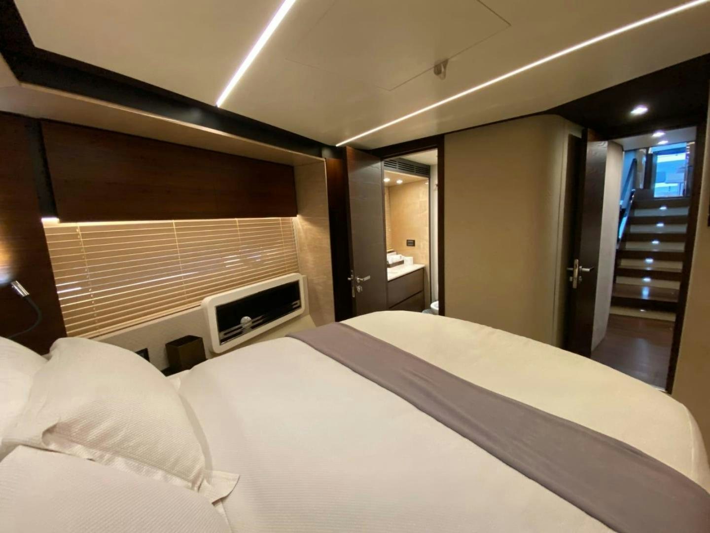 a bed in a room aboard PASEO Yacht for Sale