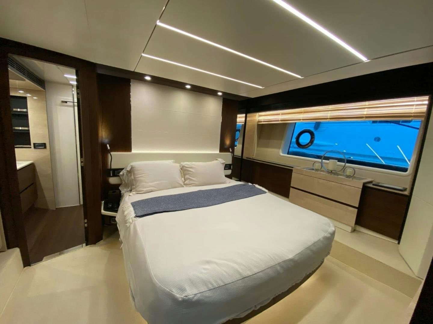 a bed in a room aboard PASEO Yacht for Sale