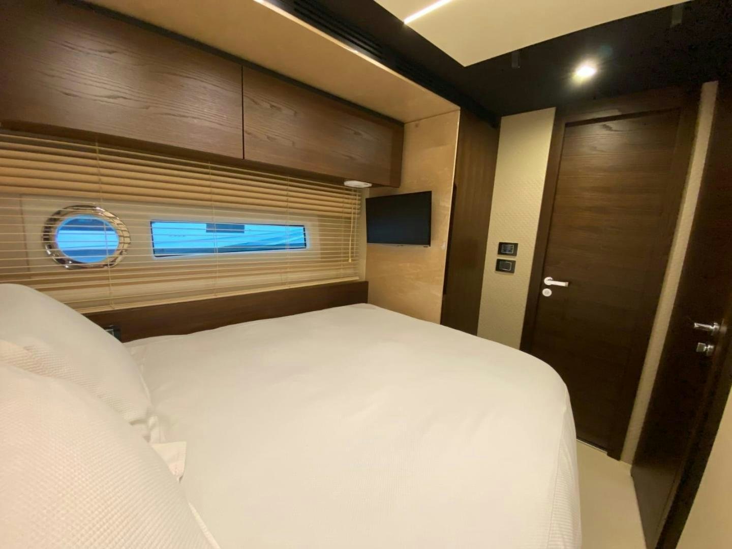 a bed in a room aboard PASEO Yacht for Sale