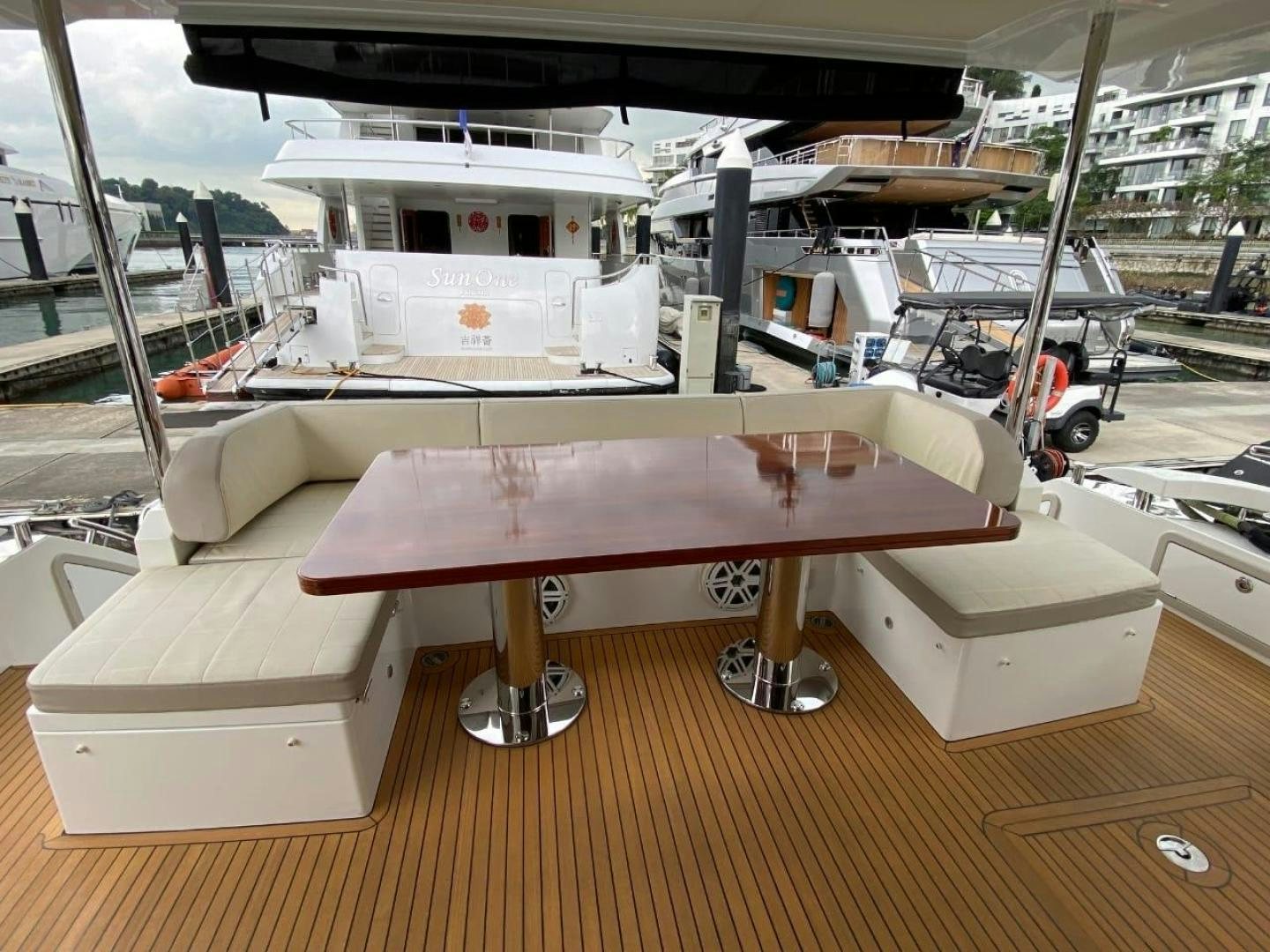 a large white boat in a warehouse aboard PASEO Yacht for Sale