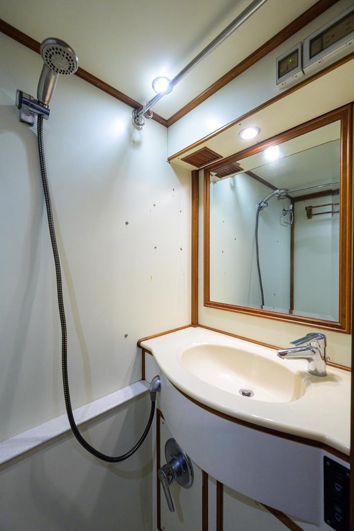 a bathroom with a sink and a mirror aboard HARD TIMES NAME RESERVED Yacht for Sale