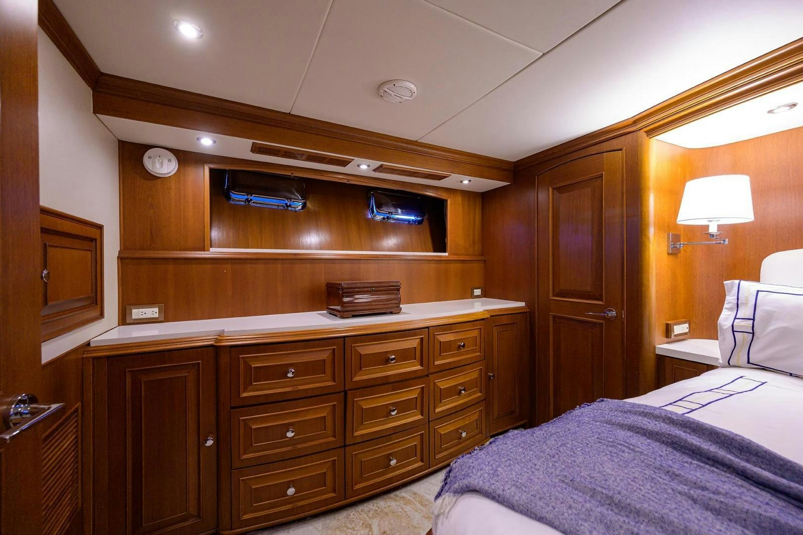 a bedroom with a bed and a shelf aboard HARD TIMES NAME RESERVED Yacht for Sale