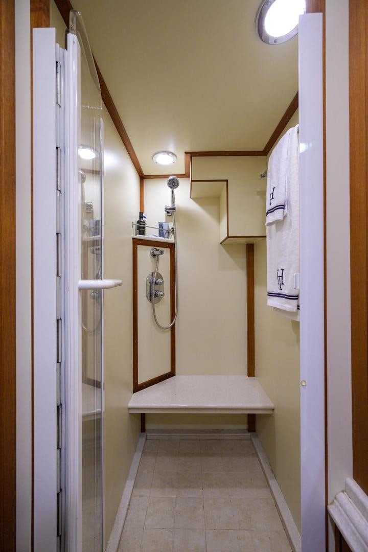 a bathroom with a white tub aboard HARD TIMES NAME RESERVED Yacht for Sale