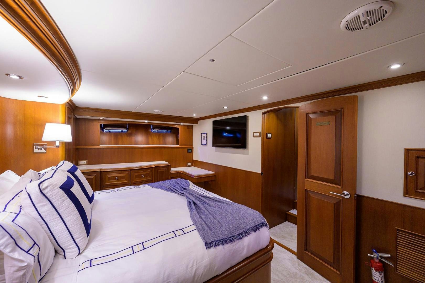 a hotel room with a bed and tv aboard HARD TIMES NAME RESERVED Yacht for Sale