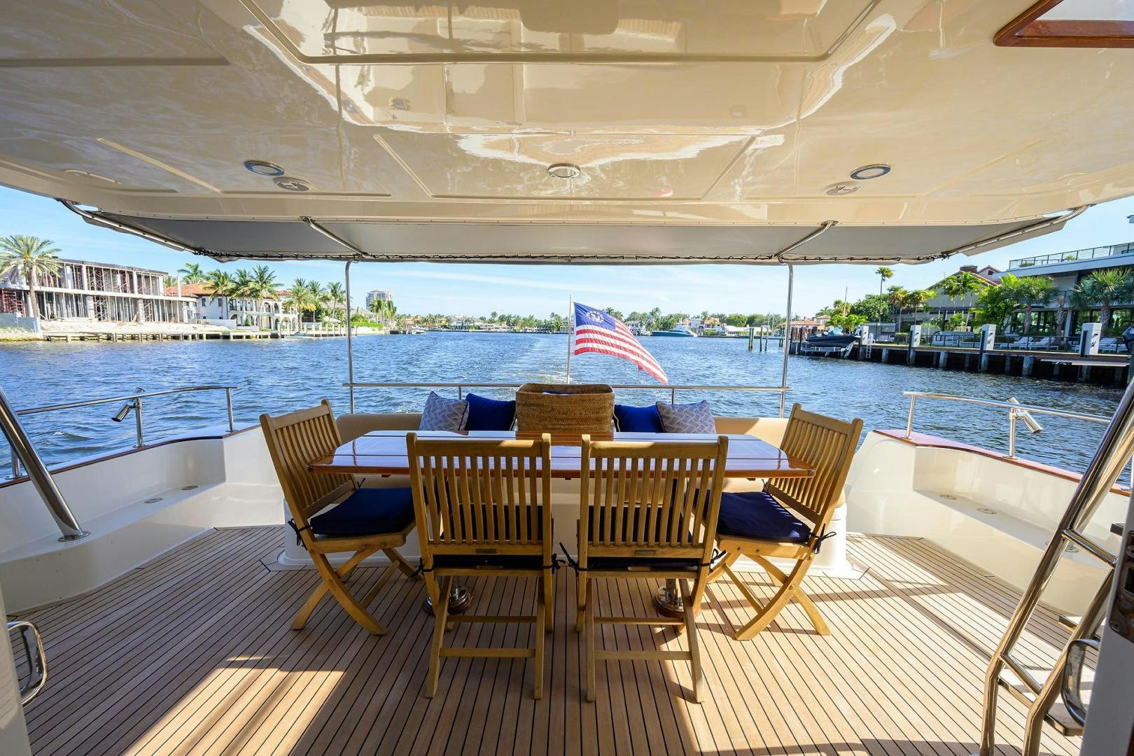 a table and chairs on a deck aboard HARD TIMES NAME RESERVED Yacht for Sale
