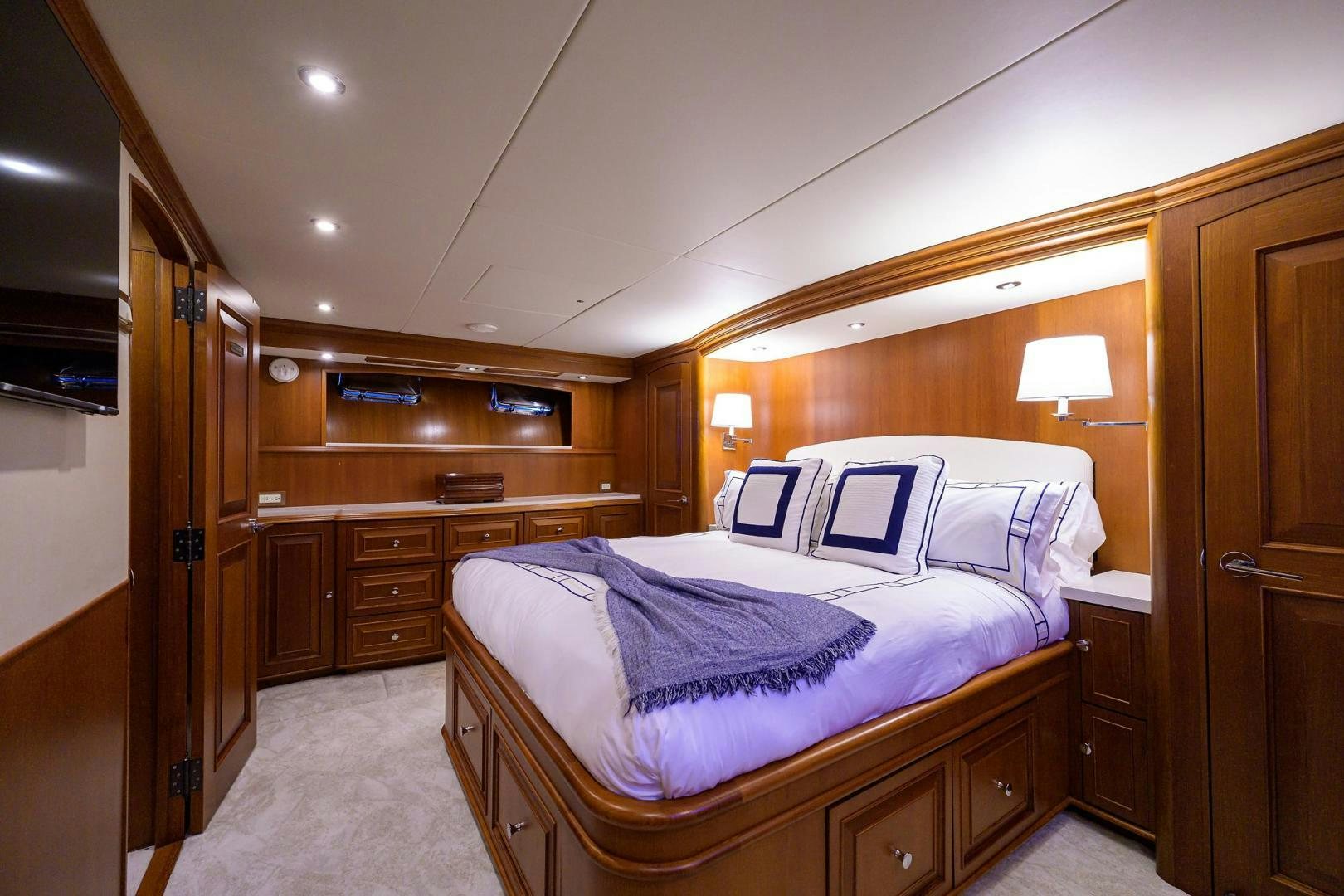a bedroom with a bed and a closet aboard HARD TIMES NAME RESERVED Yacht for Sale